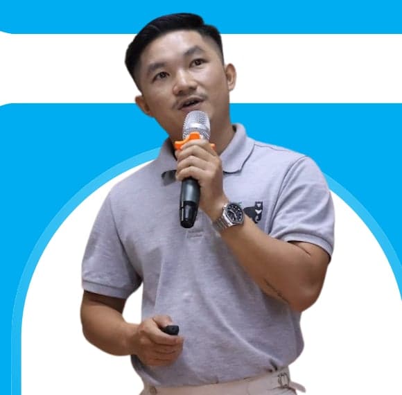 Portrait of Mr Sone Vongsa, Education Officer with Free the Bears in Luang Prabang, speaking into a microphone during a session on bear protection and wildlife conservation.